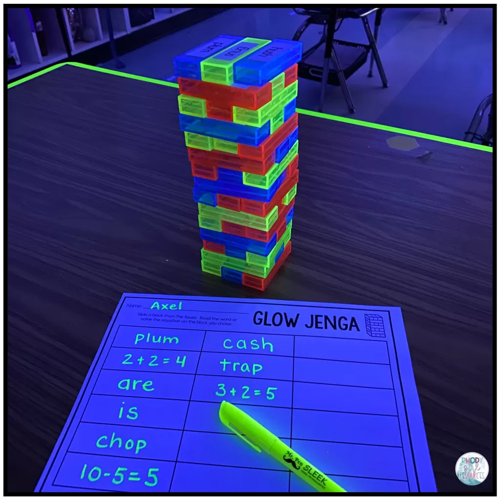 Jenga game with added words and subtraction equations on each block.